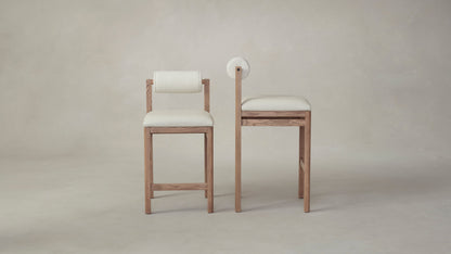 The Thayer  - Pebbled Leather Swan Seat Italian Bouclé White Bolster Bar and Counter Stool